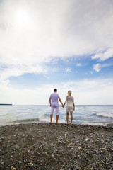 Young happy couple on the beach