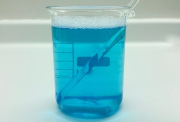 Beaker with blue bath gel
