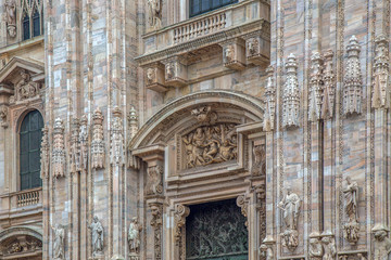Fototapeta na wymiar Part of facade with details of the Milan Cathedral
