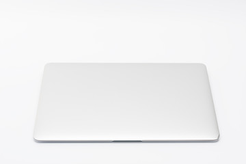 Closed  modern, new laptop on white background, top view
