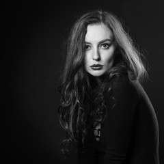 Dramatic black and white portrait of attractive girl