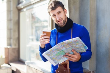 man drinking coffee while reading