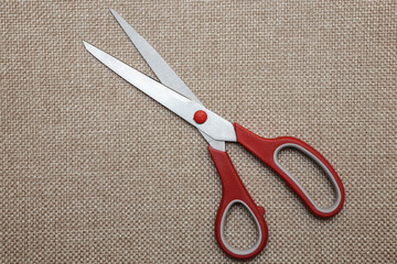 scisors with red plastic handle
