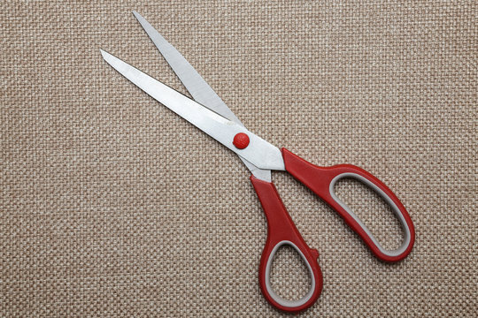scisors with red plastic handle