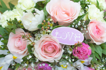 Delicate background with flowers and word love