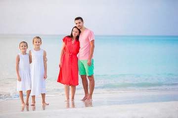Young family on vacation on caribbean beach