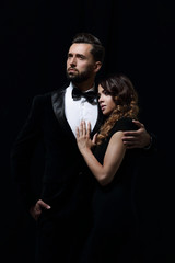 portrait of fashion couple on black background