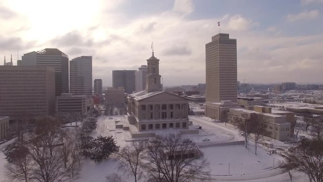 Nashville Snow- Dolly in building pass by flags
