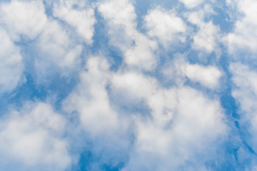 white clouds against blue sky, abstract background