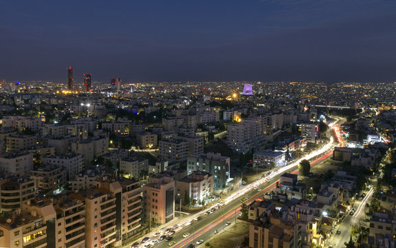 view of Amman's new downtown and abdoun bridge at night