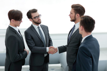 handshake business people in the office.