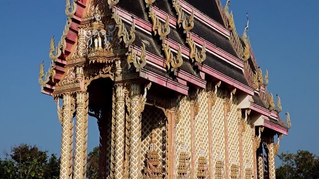 The Buddhist temple Nong Kae, Thailand. Traditional architecture - narrow monastery building, Thai countryside.