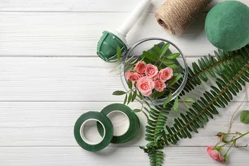 Cercles muraux Fleuriste Florist equipment with flowers on wooden background