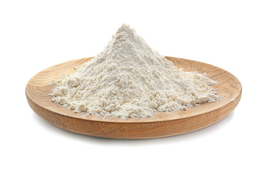 Wooden plate with wheat flour on white background