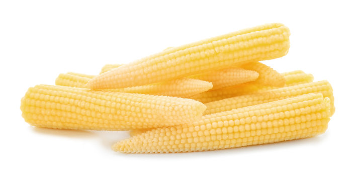 Heap of fresh young baby corn on white background