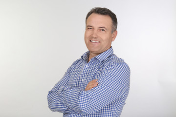 Portrait of male pensioner on white background