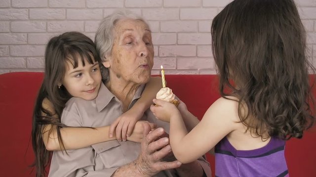 Grandmother's birthday. Granddaughter congratulate grandmother on his birthday.