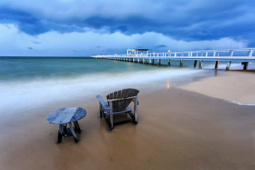 long exposure shooting of small island boat and rock in smoky and soft sea water with blue sky, Sky burst, blurred motion
