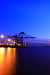 Fototapeta na wymiar Freight dock of container crane at night