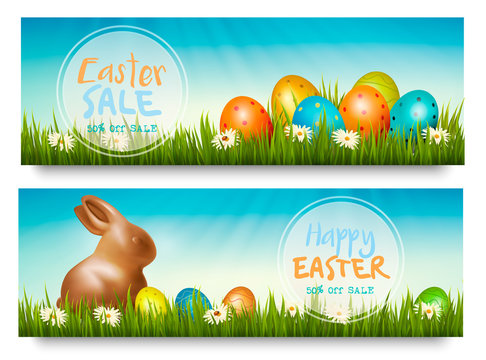 Two easter sale banners with colorful ggs in grass and a chocolate bunny. Vector.
