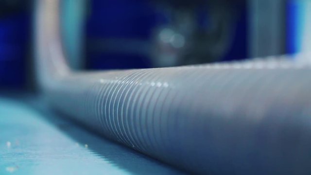 Apple mash flowing down tube before grappa production