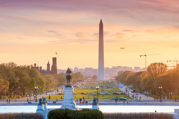 Washington DC city view at a orange sunset, including Washington - Powered by Adobe