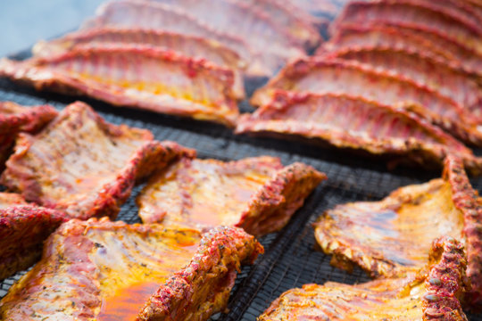 pork ribs preparing on grill brazier