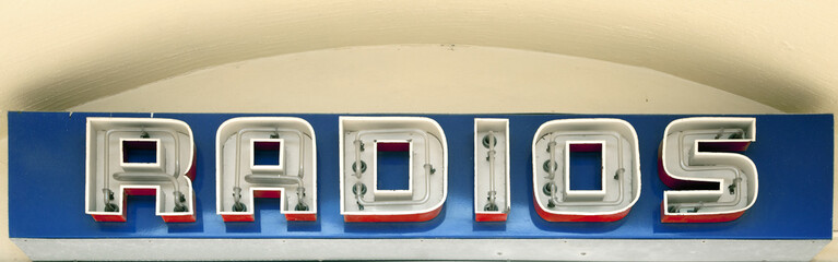 Antique neon sign for Radios in shop, US, 2017.