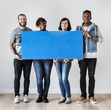 Happy multiracial people holding copyspace speech bubble