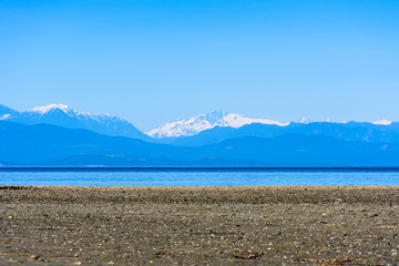 Rathtrevor Beach beach with Multi Layered of Mountain, British Columbia, Canada