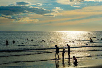 Fototapeta premium Beach on sunny day. Young boys and girl enjoying a summer day in tropical paradise for travel