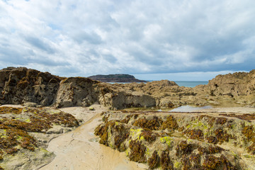 Sea rocks on a beautiful paradise french brittany beach
