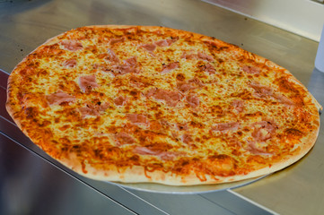 Fresh baked pizza italian cuisine, fast food abstract design background. Closeup photo