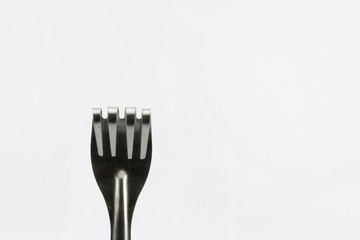 Folding fork as a symbol of handful isolated on white background.