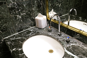 close up on ceramic sink with granite top in the bathroom
