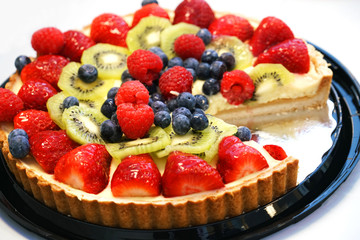 fresh cheese cake with fruit on top