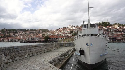 Boats in harbour against old town of Ohrid, Macedonia
