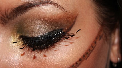 tribal fantasy eye make up in brown gold and black with falselashes