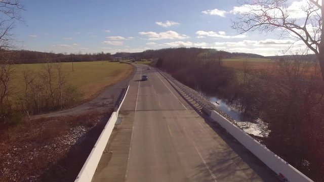 Aerial Rural Winter Black Truck Fly Over Bridge