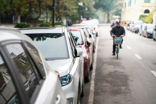 Cars parked on the urban street side