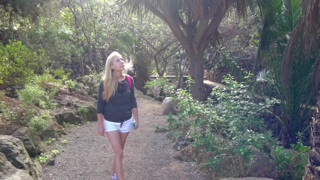 women walking in tropical park