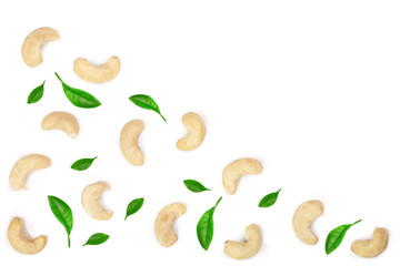 cashew nuts with leaves isolated on white background with copy space for your text. top view. Flat lay pattern