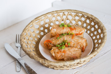 a plate of hot home stuffed cabbage rolls