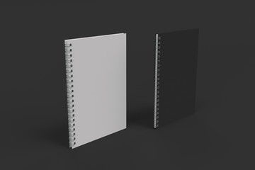 Two notebooks with spiral bound on black background