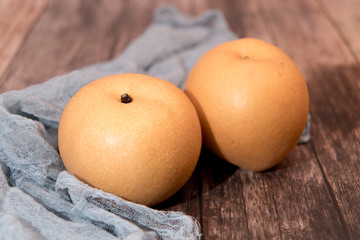 fresh organic pear fruits on the wooden backgrounds with copy space