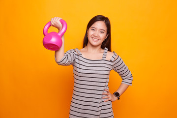 Healthy Asian woman with dumbbells.