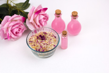top view homemade scrub with sea salt,aroma oils and rose petals
