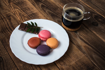 cup of coffee and macarons and chocolate