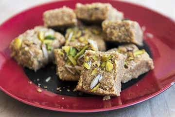 Mohanthal (sweetened gram flour fudges made with Ghee, and flavored with saffron and almonds) a Traditional Gujarati Sweet in Rajkot, Gujarat, India