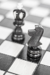 Chess. Chess board. Wooden chess pieces. black and white photo